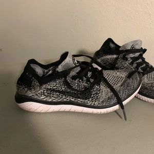 Black and grey Nike fly knit shoes